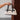 Amelia Ivory & Black Shoulder Purse - front view being held