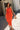 Tori Red-Orange Tiered Halter Midi Dress - front view - walking