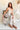 Verona Olive & White Floral Jumpsuit - full body sitting view