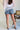 Just USA: Celine Medium Wash Distressed Denim Shorts- full back view