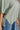 Harlow Sage Green V-Neckline Short Sleeve Top- close up side slit view
