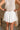 Cora White Pleated Flare Mini Skirt- back view