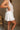 Cora White Pleated Flare Mini Skirt- side view