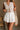 Cora White Pleated Flare Mini Skirt- front view