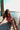 Gretchen Red & White Gingham Tank Top - sitting view on brunette model