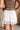 Lara Cream Lace Tiered Mini Skirt- close up back view