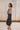 Reyna Black Satin Midi Wrap Skirt - full body side view