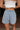 Evie Light Wash Denim Skort - back view