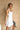 Piper White Flare Mini Dress- frontal side view