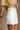 Emmy White Linen Mini Skirt - frontal side view