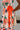 Penelope Orange Tropical Print Midi Dress - close up side view