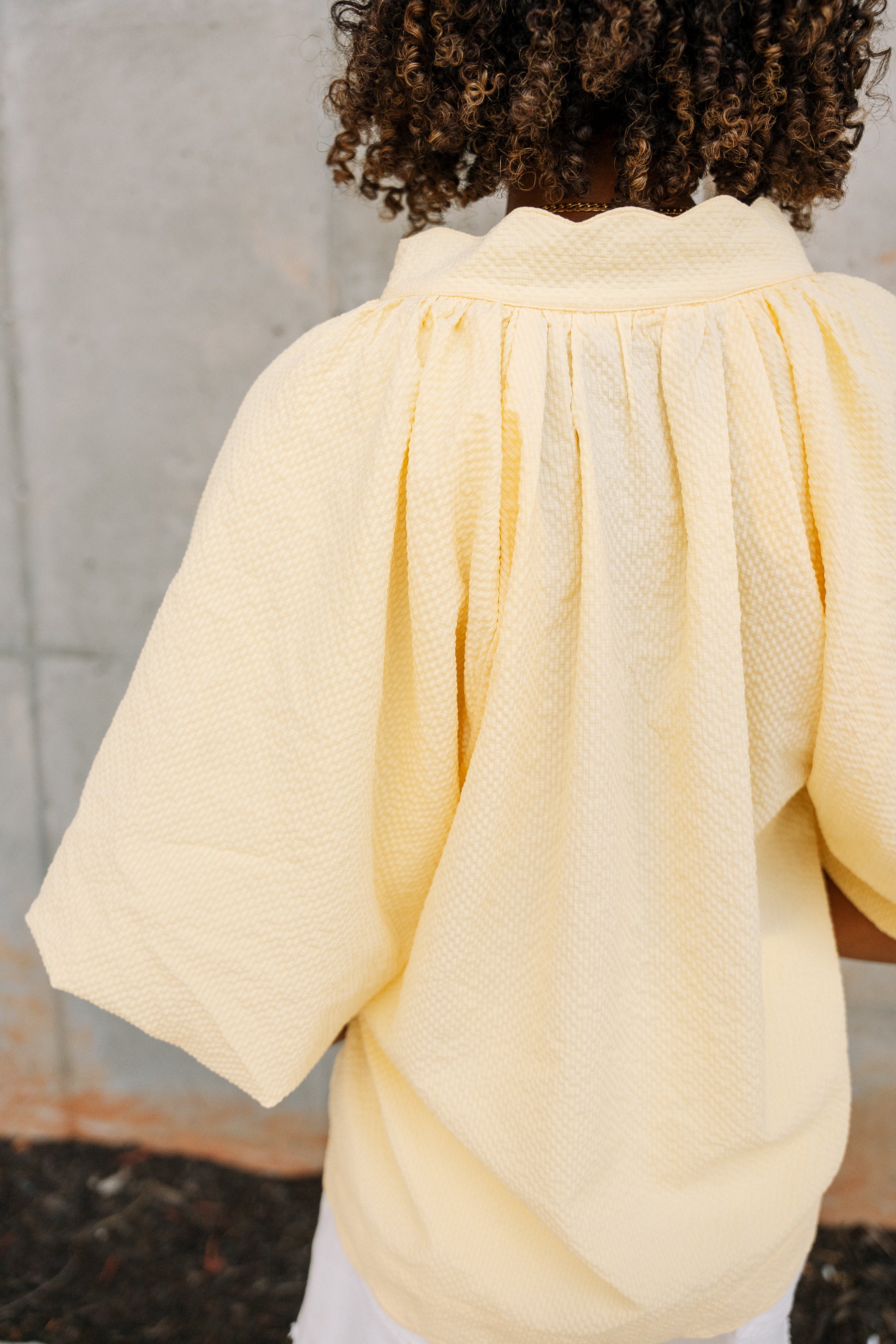 Brinley Yellow Scallop Short Sleeve Top- close up back view