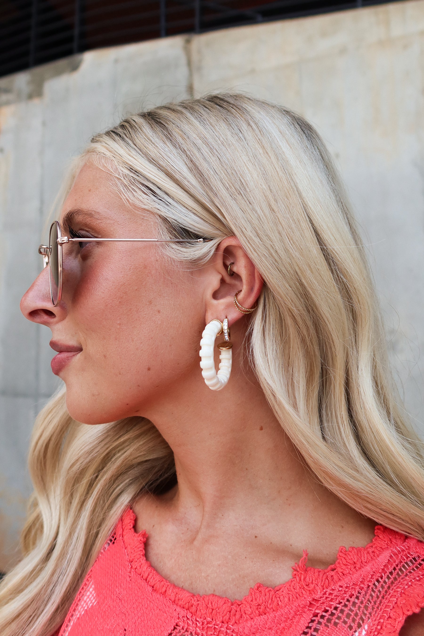 Rory Cream Ribbed Hoop Earrings - side model view