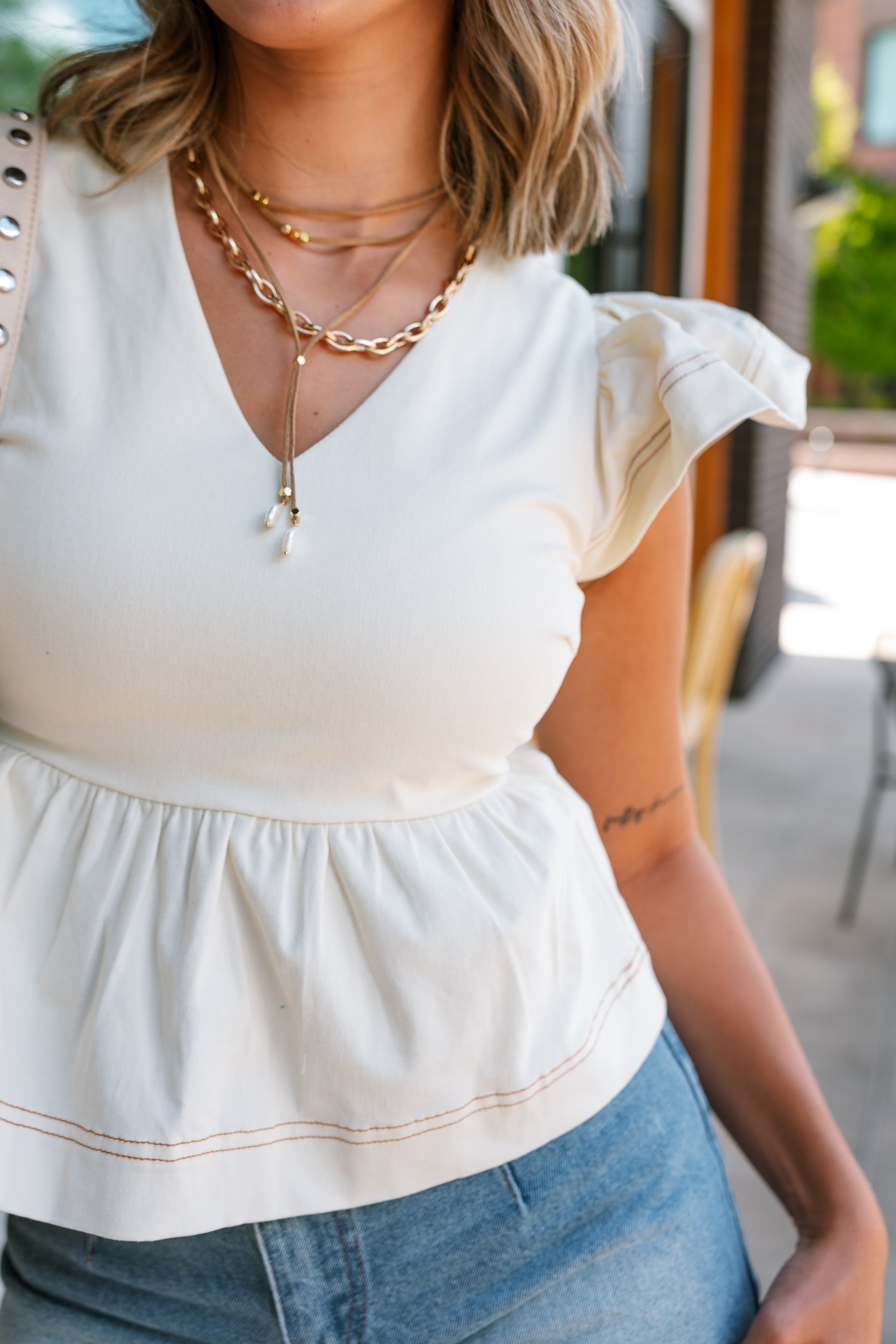 Tory Cream Denim Ruffled Peplum Top - close up front view