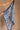 Cali Blue & Ivory Printed Satin Scarf  - held by model's hand