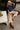 model wearing denim and stripe pants