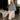 Laney Polka Dot Denim Cape Jacket - full body sitting view