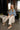 Laney Polka Dot Denim Cape Jacket - full body sitting view