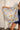 Calista Floral Satin Scarf - front view held by model