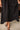 Wren Black Button-Up Eyelet Midi Dress - closeup of hemline