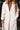 Ava Ivory Button-Up Midi Coat- close up front view