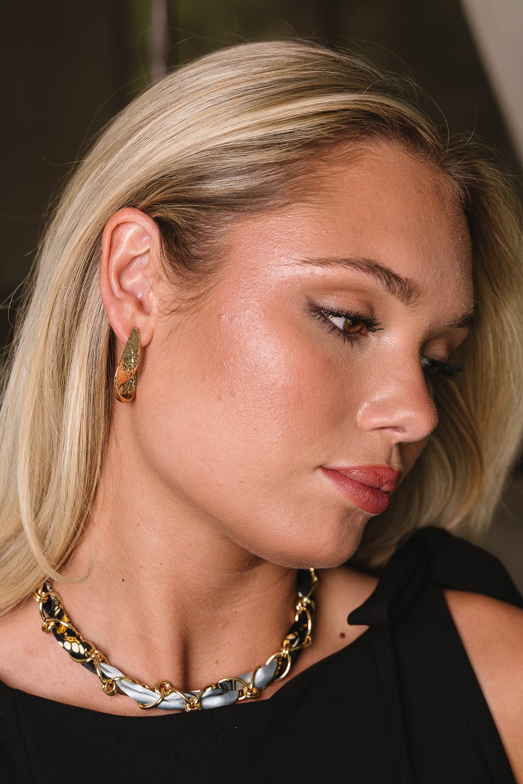 Chantel Gold Hammered Twist Hoop Earrings - side view on model