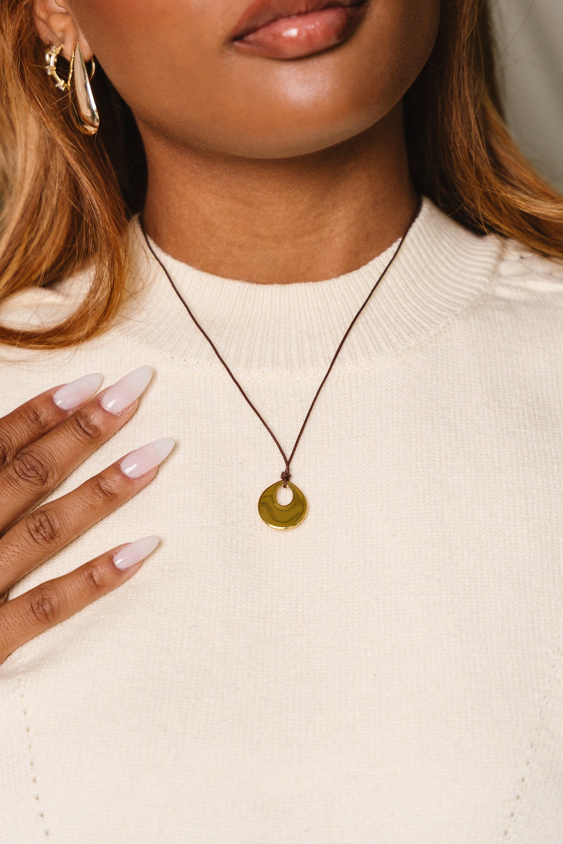 Corinne Brown Leather & Gold Pendant Necklace - close up view on model