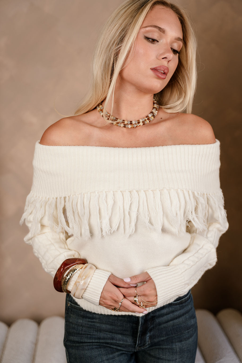 Raya Ivory Fringe Off-The-Shoulder Sweater- close up top view