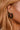 Mira Brown Tortoise Earrings - close up side view on model