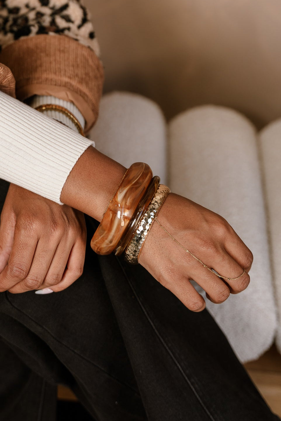 Rory Brown & Gold Bangle Set - close up on model's wrist