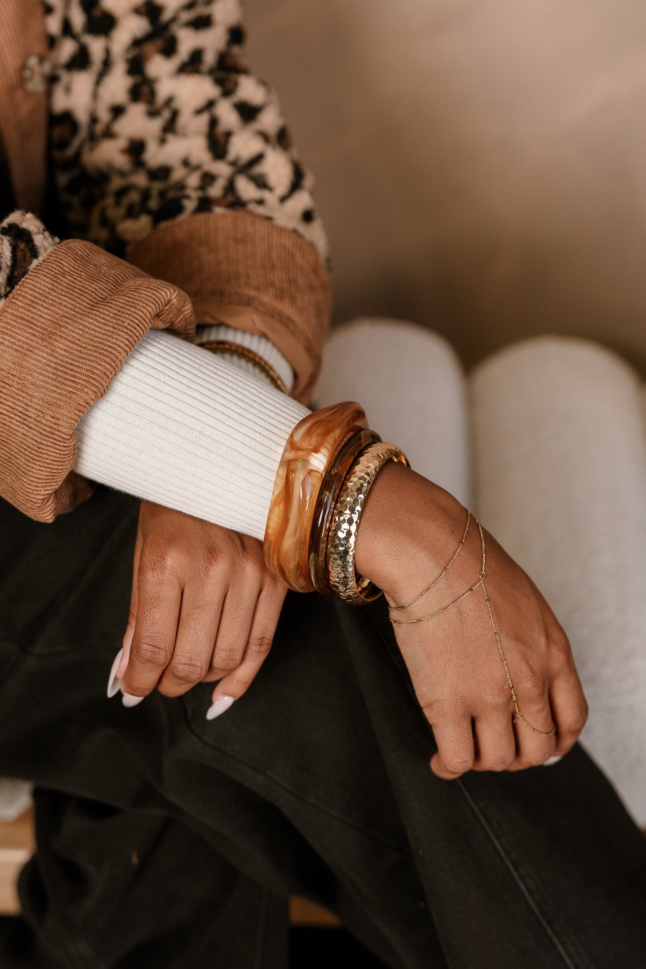 Rory Brown & Gold Bangle Set - shown on model's wrist