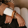 Rory Brown & Gold Bangle Set - shown on model's wrist