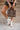 Dinsdale Chocolate Brown & Cream Zebra Purse- lower body of model shown holding purse