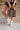 Dinsdale Chocolate Brown & Cream Zebra Purse- lower body of model shown holding purse