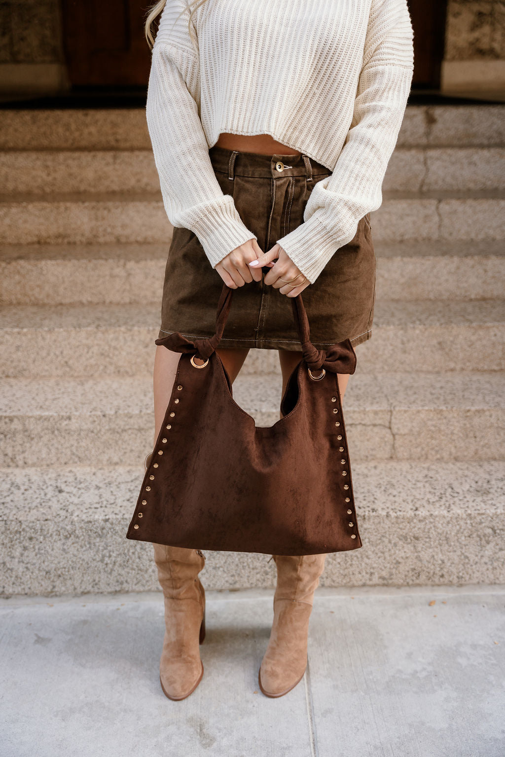 Sophia Dark Brown Suede & Studs Tote- model is holding purse