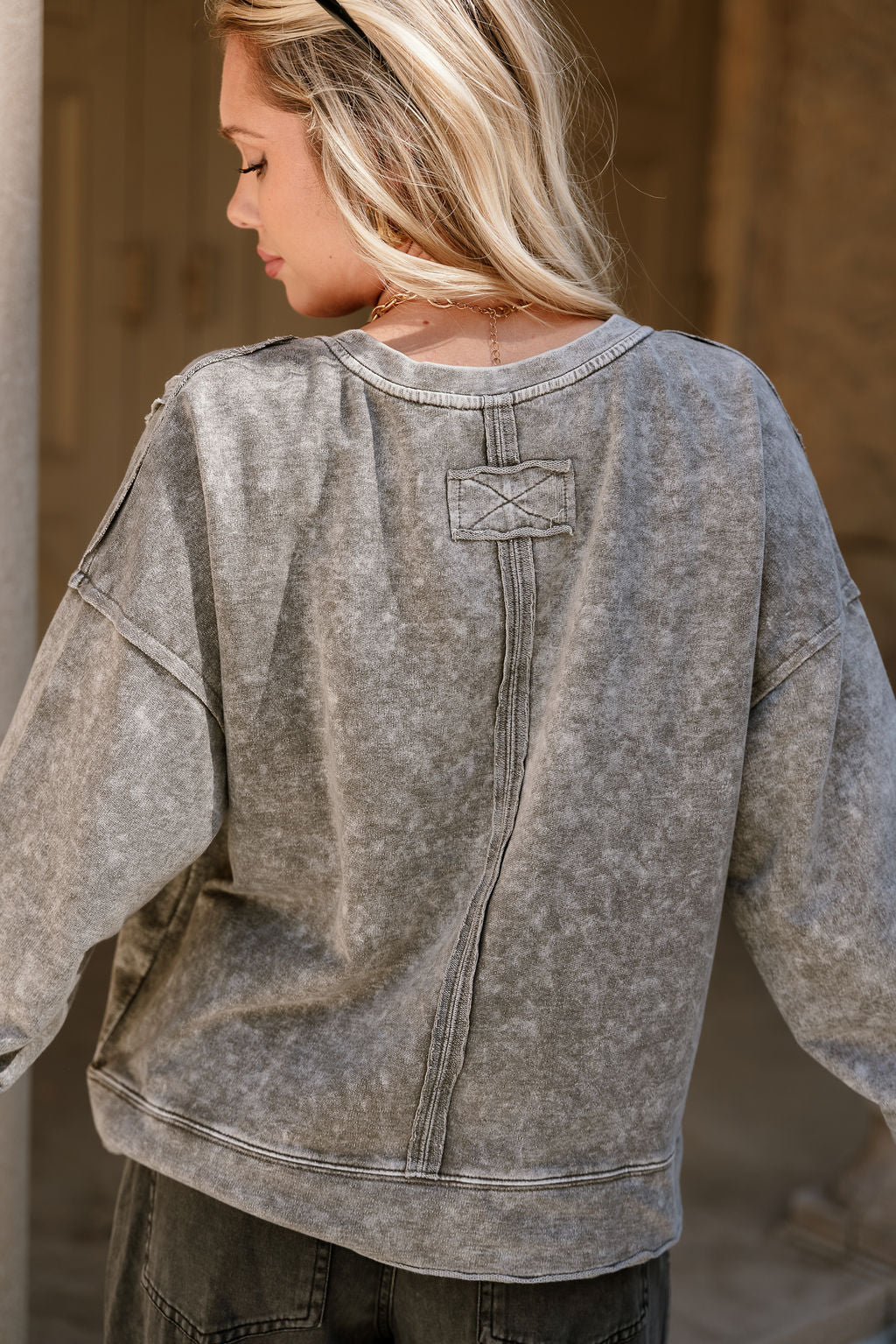 Leila Washed Black Long Sleeve Top- close up back view