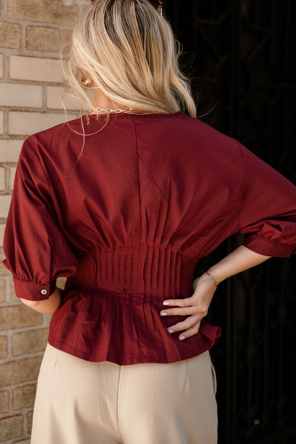 Elianna Burgundy Pleated Zip-Up Top- close up back view