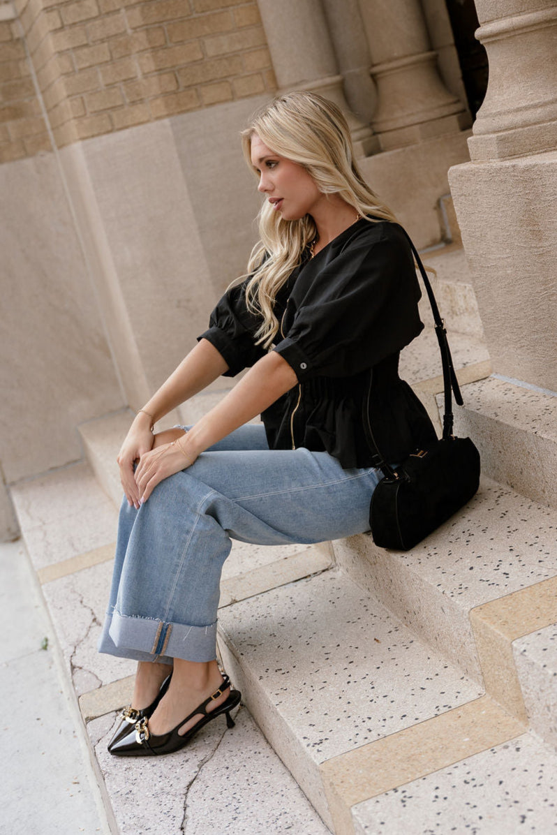 Brittany Black Zip-Up Flare Top - side sitting view