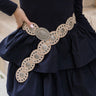 Ada Beige & Silver Oval Buckle Boho Belt - close up front view on model