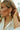 Evangeline Gold Cross Earrings -  side view on model