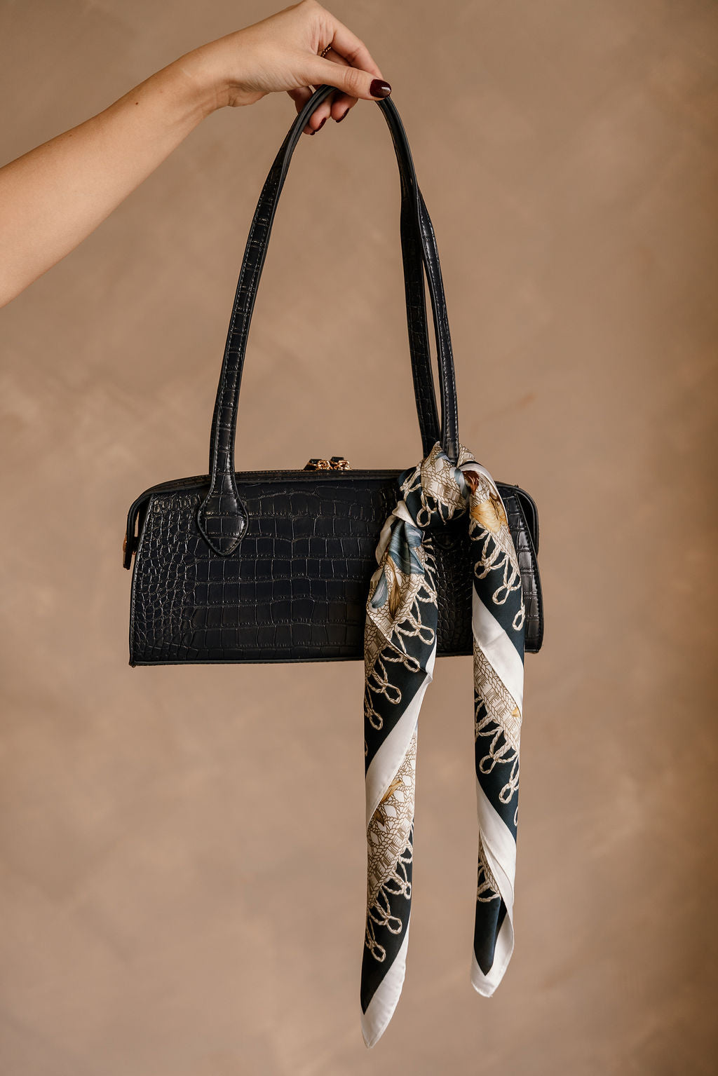 Lyla Navy Multi Printed Satin Scarf - shown tied on purse