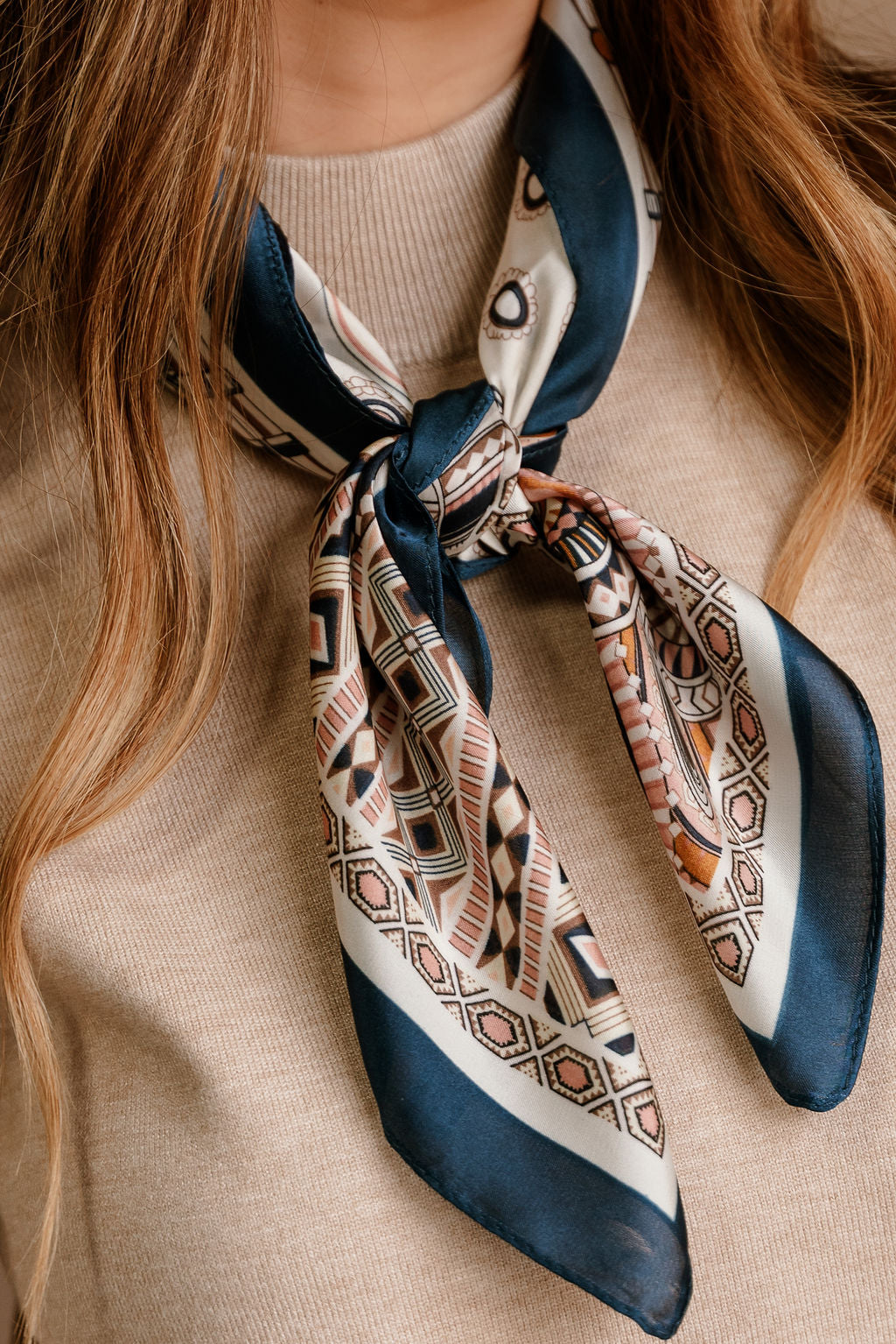 Chandler Navy Multi Tropical Print Satin Scarf - close up front view tied on model's neck