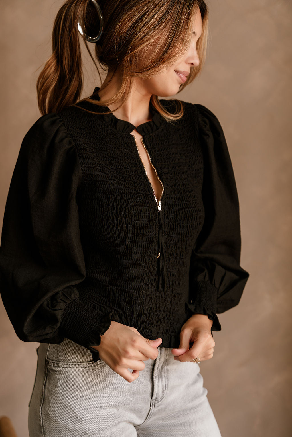 Andrea Black Zip-Up Top- close up frontal side view