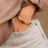 Aria Brown Beaded Bracelet - close up on model's wrist