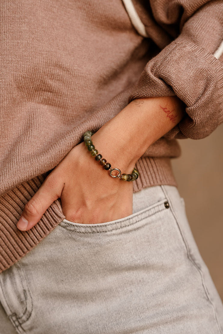 Aria Olive Beaded Bracelet - close up view on model's wrist