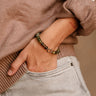 Aria Olive Beaded Bracelet - close up view on model's wrist