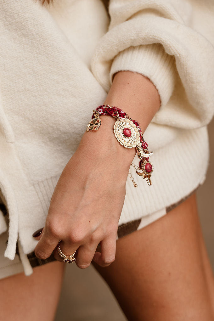 Heidi Burgundy Scarf & Western Charm Bracelet - close up on model's wrist