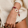 Heidi Burgundy Scarf & Western Charm Bracelet - close up on model's wrist