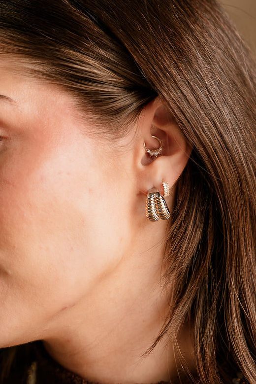 Shelly Silver & Gold Ribbed Hoop Earrings - close up on model