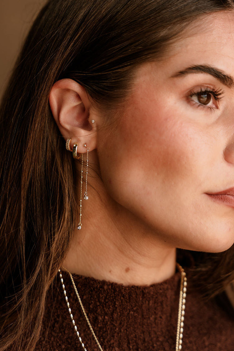Brandy Gold & Pearl Chain Earrings - side view on model